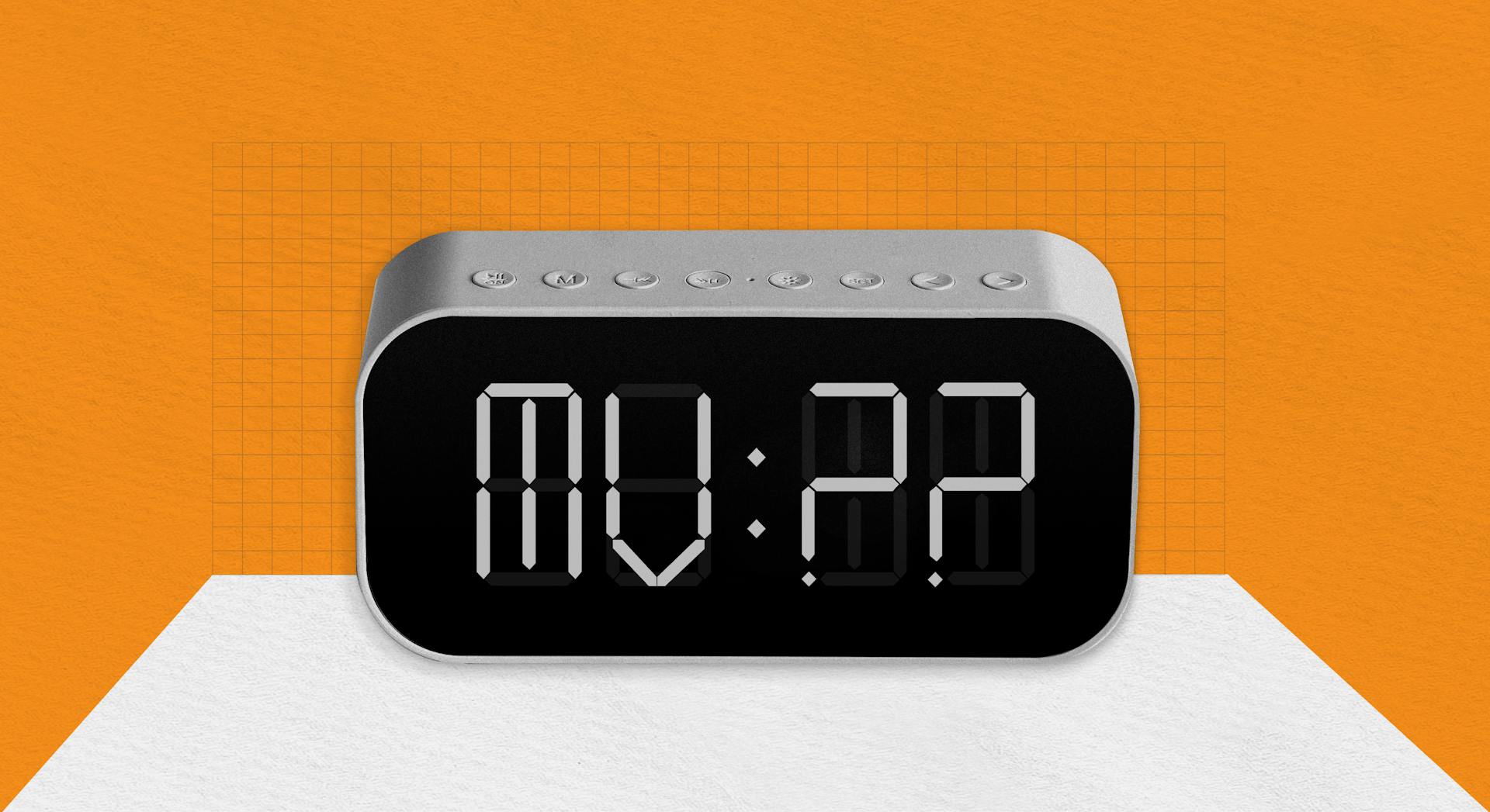 An illustration of an alarm clock with MV:?? on the face, on an orange background