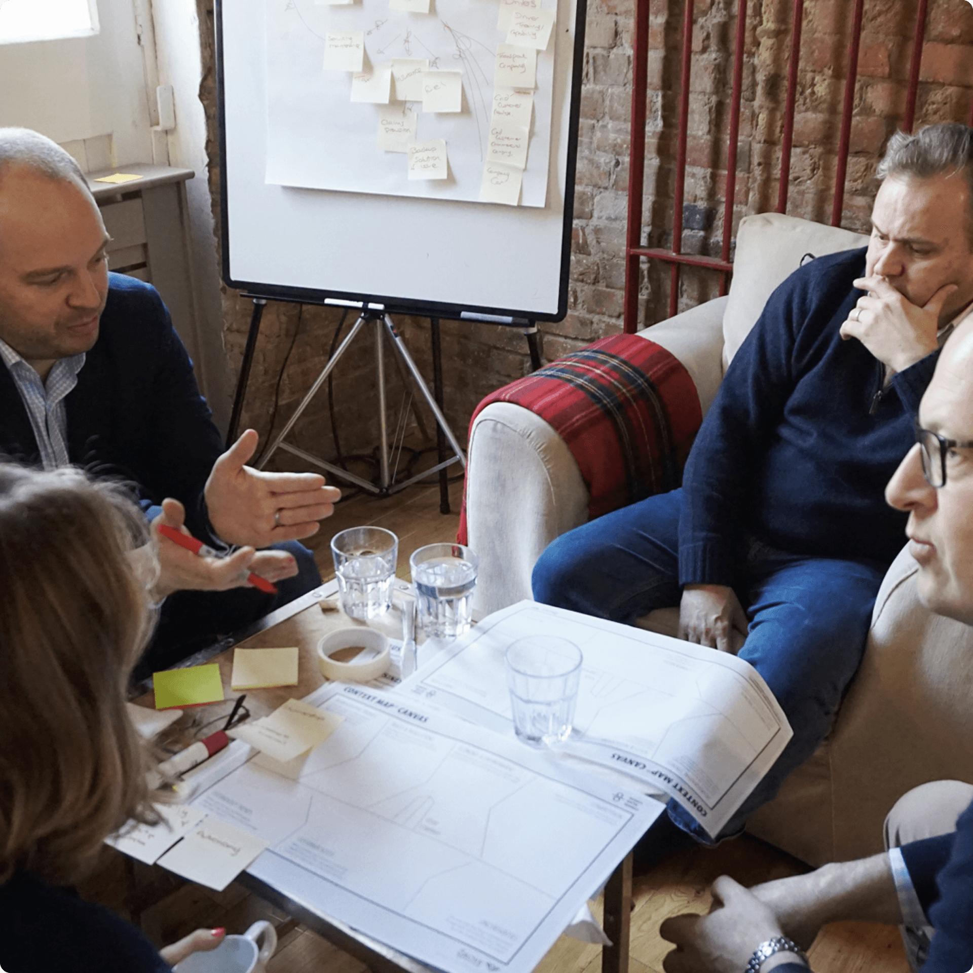 A group of employees and strategists discussing the proposition. A group of employees and strategists discussing the proposition.