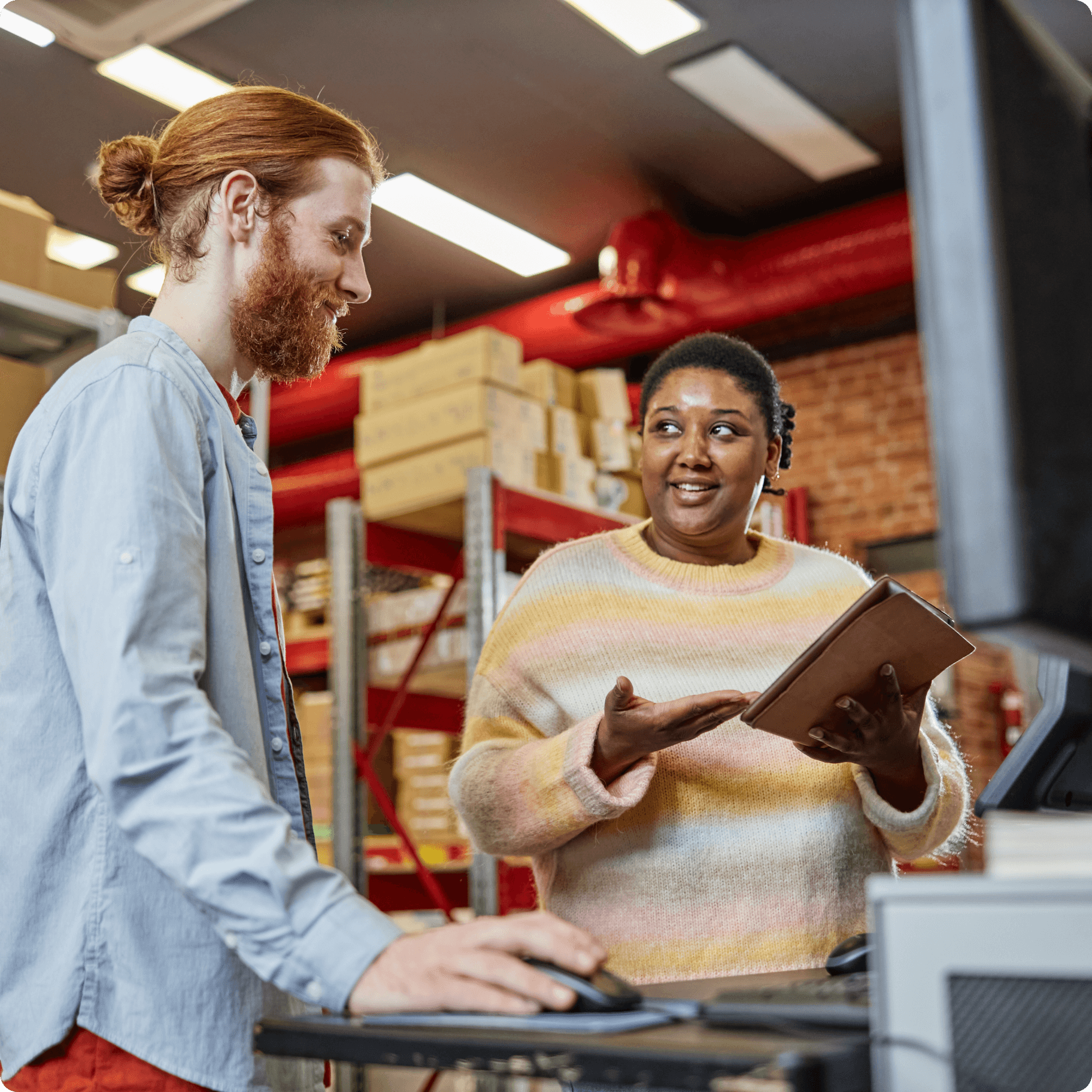 Two people talking on a shop floor. Two people talking on a shop floor.